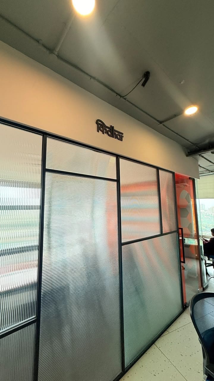 The Kidhar meeting room at SoCheers, behind fluted glass