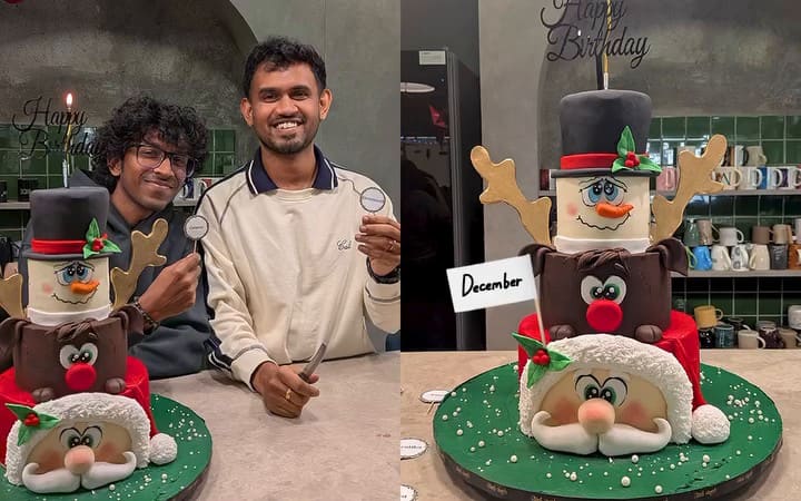 Cutting a snowman-and-Santa cake at the SoCheers Christmas party