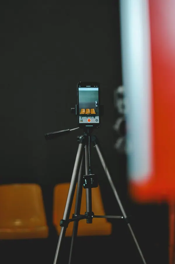 A phone on a tripod, recording