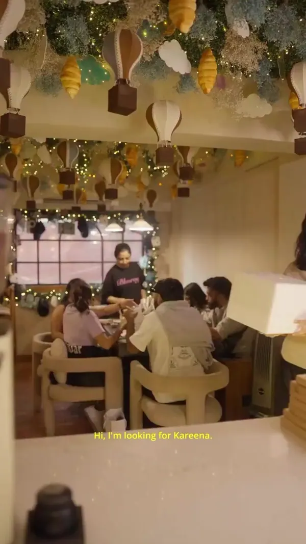 Friends around a table in a decorated cafe
