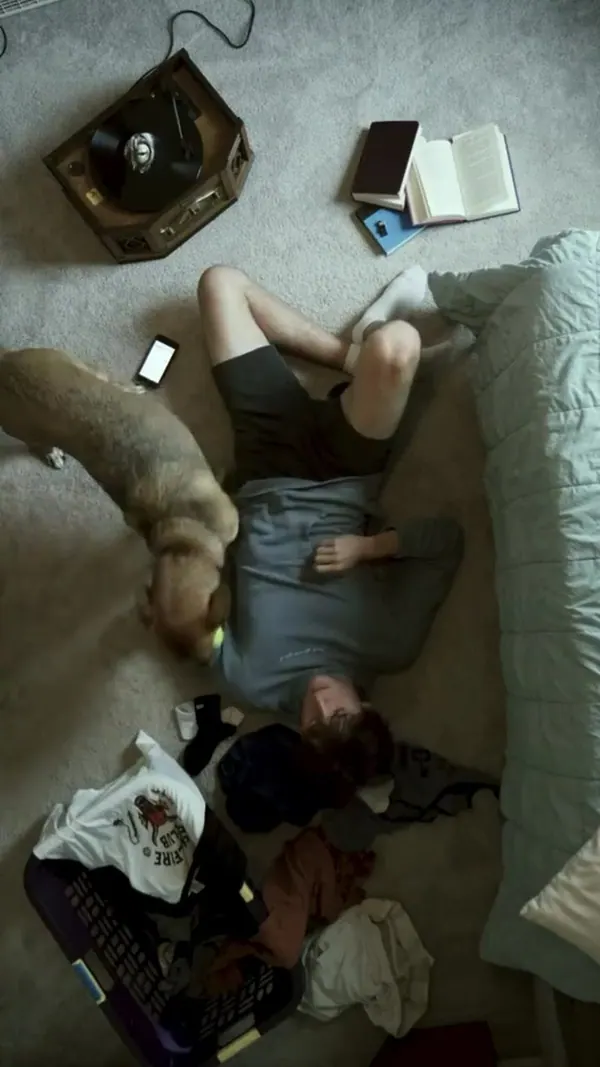 Overhead shot of a woman on the floor with her phone